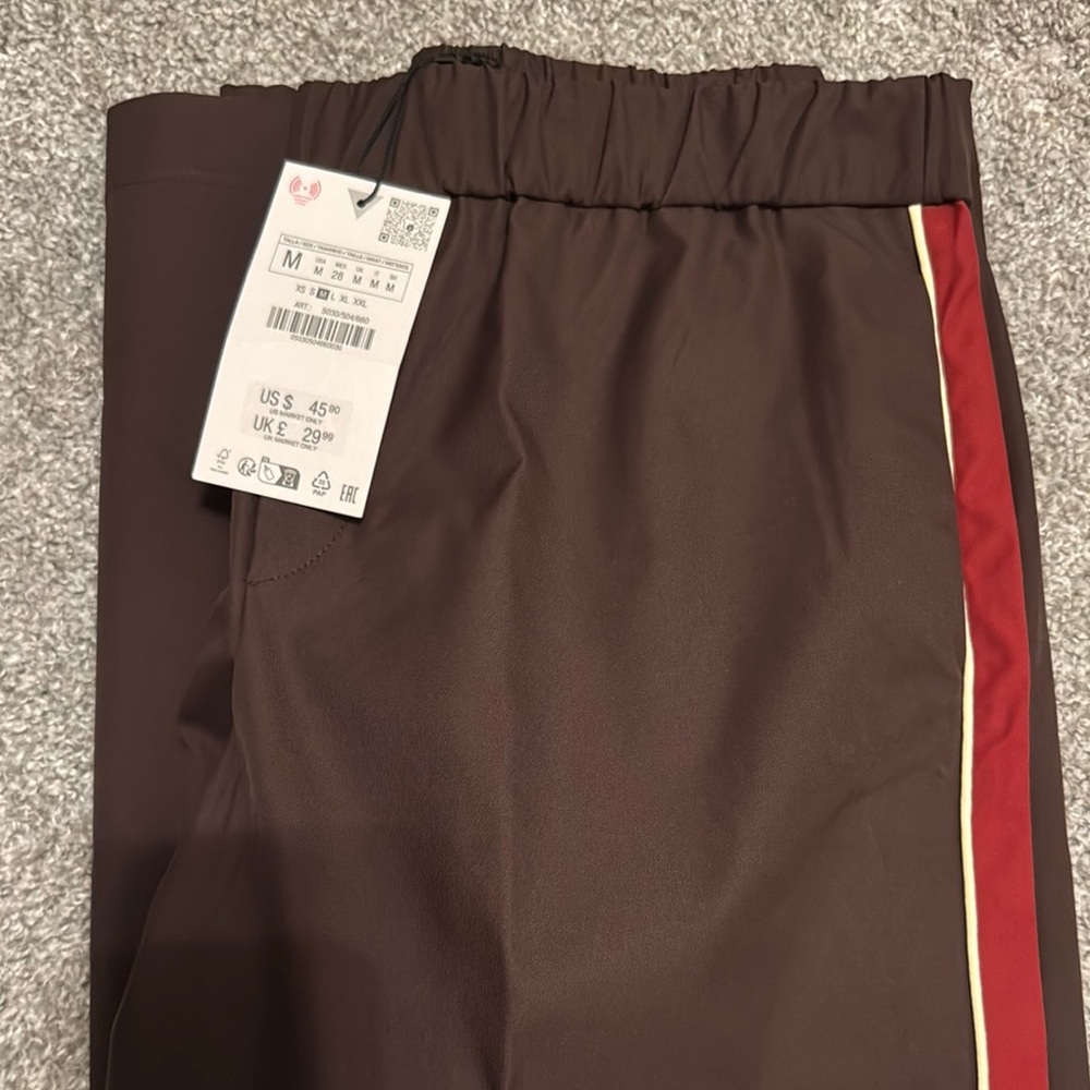 Brand new Zara wine colored pants with side stripe
